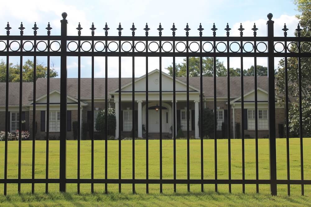 Black aluminum estate fence with finials and ring detail