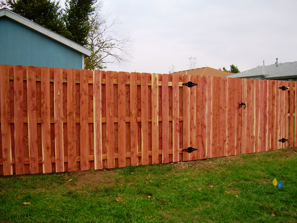 Eastern red cedar shadowbox privacy fence with matching walk gate and decorative hinges